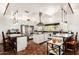 Spacious kitchen featuring white cabinets, stainless steel appliances, and center island at 9401 N 122Nd Pl, Scottsdale, AZ 85259