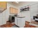 Well-equipped laundry room with granite counters, plenty of storage and modern appliances at 9401 N 122Nd Pl, Scottsdale, AZ 85259