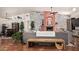 Cozy living room featuring a white-washed brick fireplace, beamed ceilings, and comfortable seating at 9401 N 122Nd Pl, Scottsdale, AZ 85259