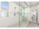 Modern bathroom with glass shower, white tile, and updated fixtures at 10043 W Foothill Dr, Peoria, AZ 85383