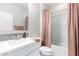 Bathroom featuring a vanity with sink, muted colors, and a tub shower with rose colored shower curtain at 10043 W Foothill Dr, Peoria, AZ 85383