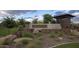 The Meadows entrance featuring stone accents and landscaped surroundings at 10043 W Foothill Dr, Peoria, AZ 85383
