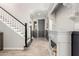 Inviting foyer features staircase, decorative fireplace, and stylish tile flooring at 10043 W Foothill Dr, Peoria, AZ 85383