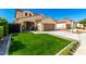 Beautiful two-story home boasting a lush green lawn and a welcoming front entrance at 10043 W Foothill Dr, Peoria, AZ 85383