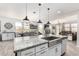 Bright, open kitchen with granite countertops, stainless steel sink, and ample cabinetry at 10043 W Foothill Dr, Peoria, AZ 85383