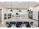 Stylish kitchen boasts a large center island with barstool seating and modern appliances at 10043 W Foothill Dr, Peoria, AZ 85383