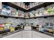 Well-organized pantry with open shelving, decorative tile, and ample storage at 10043 W Foothill Dr, Peoria, AZ 85383