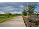 Scenic walking path with seating offers a peaceful outdoor experience at 10043 W Foothill Dr, Peoria, AZ 85383