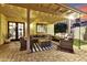 Cozy covered patio with stylish seating and a swing, perfect for relaxing and entertaining at 11033 E Poinsettia Dr, Scottsdale, AZ 85259
