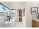 Modern bathroom featuring a freestanding tub, large windows, and views to the outdoor greenery at 11033 E Poinsettia Dr, Scottsdale, AZ 85259