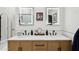 Bathroom features double sinks with quartz countertops, modern faucets and cabinet with hardware at 11033 E Poinsettia Dr, Scottsdale, AZ 85259