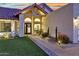 Home's front entrance showing desert landscaping, walkway and inviting doorway at 11033 E Poinsettia Dr, Scottsdale, AZ 85259