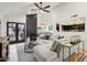 Bright living room featuring a modern fireplace, comfortable seating, and stylish decor at 11033 E Poinsettia Dr, Scottsdale, AZ 85259