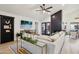 Spacious living room with a fireplace, large sectional sofa, and contemporary decor at 11033 E Poinsettia Dr, Scottsdale, AZ 85259
