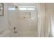 Bright bathroom features marble tile surround, shower niche, and built in towel bar at 1222 W Corriente Dr, San Tan Valley, AZ 85143