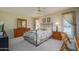 Spacious main bedroom features a ceiling fan, nice furniture, and natural light at 12634 W Seneca Dr, Sun City West, AZ 85375