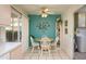 Cozy breakfast nook with a round table, seating for four, and bright, cheerful decor at 12634 W Seneca Dr, Sun City West, AZ 85375