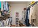 Walk-in closet featuring built-in shelving for storage, and clothing racks on both sides at 12634 W Seneca Dr, Sun City West, AZ 85375