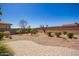 A well-kept backyard with desert landscaping, a paver patio, and a brick wall is ideal for outdoor living at 13660 N 144Th Ln, Surprise, AZ 85379