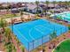 View of community basketball court with fencing, landscaping, and common area seating around the court at 13660 N 144Th Ln, Surprise, AZ 85379