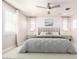 Serene bedroom with a plush bed, soft lighting, ceiling fan, and window shutters at 13660 N 144Th Ln, Surprise, AZ 85379