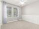 Bedroom with white trim and two windows that provide natural light at 13660 N 144Th Ln, Surprise, AZ 85379