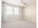 This bedroom features designer wallpaper, neutral carpet and modern window treatments at 13660 N 144Th Ln, Surprise, AZ 85379