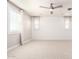Neutral bonus room with carpet, ceiling fan, and a shiplap accent wall at 13660 N 144Th Ln, Surprise, AZ 85379