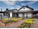 Exterior of the community building showcasing lovely landscaping, outdoor seating, and a modern aesthetic at 13660 N 144Th Ln, Surprise, AZ 85379
