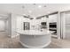 Bright, modern kitchen featuring an island with pendant lights and stainless steel appliances at 13660 N 144Th Ln, Surprise, AZ 85379
