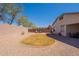 Spacious backyard features a unique grass design, rock landscaping and a block wall at 1374 E Linda Dr, Casa Grande, AZ 85122