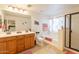 Bright bathroom featuring double vanity sinks and a bathtub shower combo for convenience and style at 1374 E Linda Dr, Casa Grande, AZ 85122