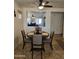 Dining area with a view to living room, features stylish decor and great natural light at 1374 E Linda Dr, Casa Grande, AZ 85122