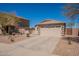 Charming single-story home featuring a spacious driveway, neutral tones, and a well-maintained desert-style landscape at 1374 E Linda Dr, Casa Grande, AZ 85122