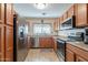 Well-appointed kitchen with stainless steel appliances and ample cabinetry for efficient storage solutions at 1374 E Linda Dr, Casa Grande, AZ 85122