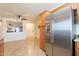 Spacious kitchen with a pass-through, stainless steel refrigerator and ample cabinet space at 1374 E Linda Dr, Casa Grande, AZ 85122