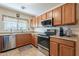 Well-lit kitchen featuring stainless steel appliances, granite countertops, and ample cabinet space at 1374 E Linda Dr, Casa Grande, AZ 85122