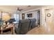 Open living room with tile flooring, plush seating, and access to the outdoor patio at 1374 E Linda Dr, Casa Grande, AZ 85122