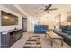 Spacious living room featuring a fireplace, display case, and comfortable seating at 1374 E Linda Dr, Casa Grande, AZ 85122
