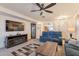 Spacious living room featuring a fireplace, display case, and comfortable seating at 1374 E Linda Dr, Casa Grande, AZ 85122