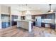 Spacious kitchen featuring modern cabinetry, granite countertops, stainless steel appliances, and a kitchen island at 14443 W Morning Star Trl, Surprise, AZ 85374