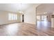 Spacious living room with tile flooring, plantation shutters, and an open floor plan, perfect for entertaining at 14443 W Morning Star Trl, Surprise, AZ 85374