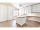 Bright office with wood floors, custom cabinets, large desk, and natural light from the shuttered window at 14443 W Morning Star Trl, Surprise, AZ 85374