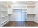 Walk-in closet with custom shelving and ample storage space for clothing and accessories at 14443 W Morning Star Trl, Surprise, AZ 85374