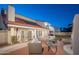 Spacious backyard features an outdoor patio area with an outdoor kitchen and well-maintained garden and lawn at 15021 N 19Th Way, Phoenix, AZ 85022