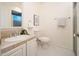 Charming bathroom featuring white vanity, a shower, and a toilet at 15021 N 19Th Way, Phoenix, AZ 85022