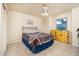 Bedroom featuring a queen bed, ceiling fan, and a dresser at 15021 N 19Th Way, Phoenix, AZ 85022