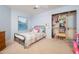 Cozy bedroom with ample natural light, ceiling fan, and closet at 15021 N 19Th Way, Phoenix, AZ 85022