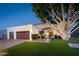 Inviting single-Gathering home featuring a lush lawn, mature tree, private entrance and a two-car garage at 15021 N 19Th Way, Phoenix, AZ 85022