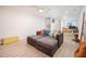 Bright living room with a brown sectional sofa, light wood floors, and textured walls creating a comfortable and inviting space at 15021 N 19Th Way, Phoenix, AZ 85022
